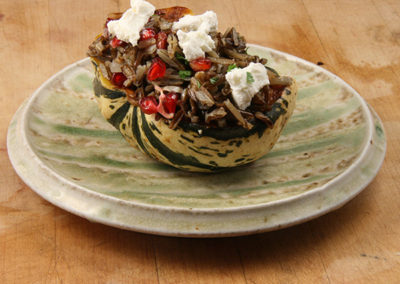 Sweet Dumpling Squash with Wild Rice, Pomegranate, & Goat Cheese