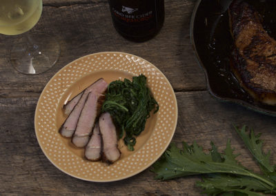 Cider Marinated Pork Chops with Wilted Greens